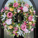 Luxury artificial floral wreath with pink, white, and yellow flowers for front door. Featuring roses, ranunculus, hydrangea, berries, blossom, astilbe and thistle.