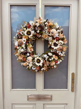 Half door view of luxury artificial 60cm cream sunflower wreath with pumpkins and florals