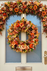 A luxury artificial 60cm autumn wreath in oranges and browns with velvet pumpkins and pinecones