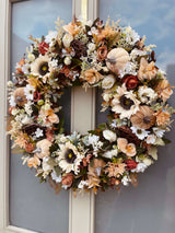 Side view of extra large luxury artificial cream and brown autumn wreath