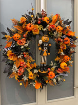 Luxury autumn wreath with Halloween pumpkin nutcracker