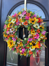 Luxury large summer wreath adorned with bright sunflowers, roses, and colorful foliage, perfect for home decor.