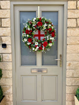 Full door view of luxury artificial England wreath with red and white flowers