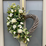 Luxury artificial heart shaped wreath with cream florals and lush foliage 
