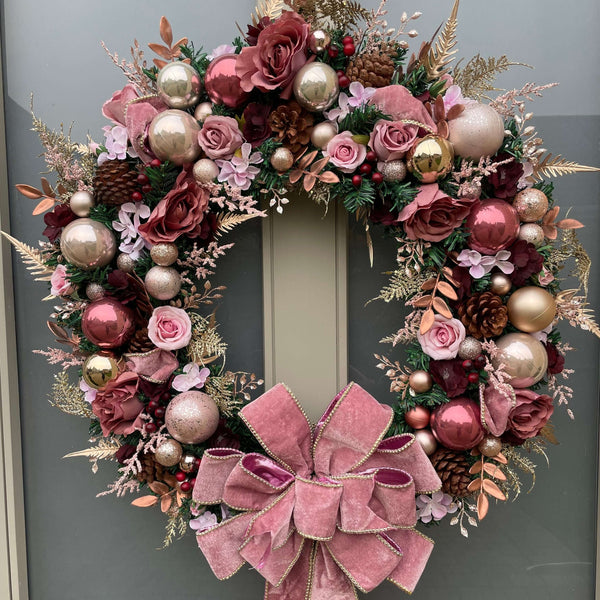 Rich pink and burgundy flower and bauble luxury artificial Christmas wreath 