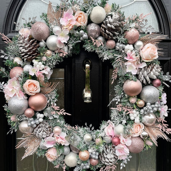 A Pink and silver artificial wreath that is a large 60cm with lots of texture and glitz