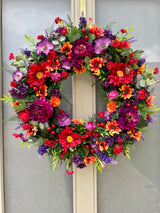 Luxury artificial bright summer wreath purple, red and orange