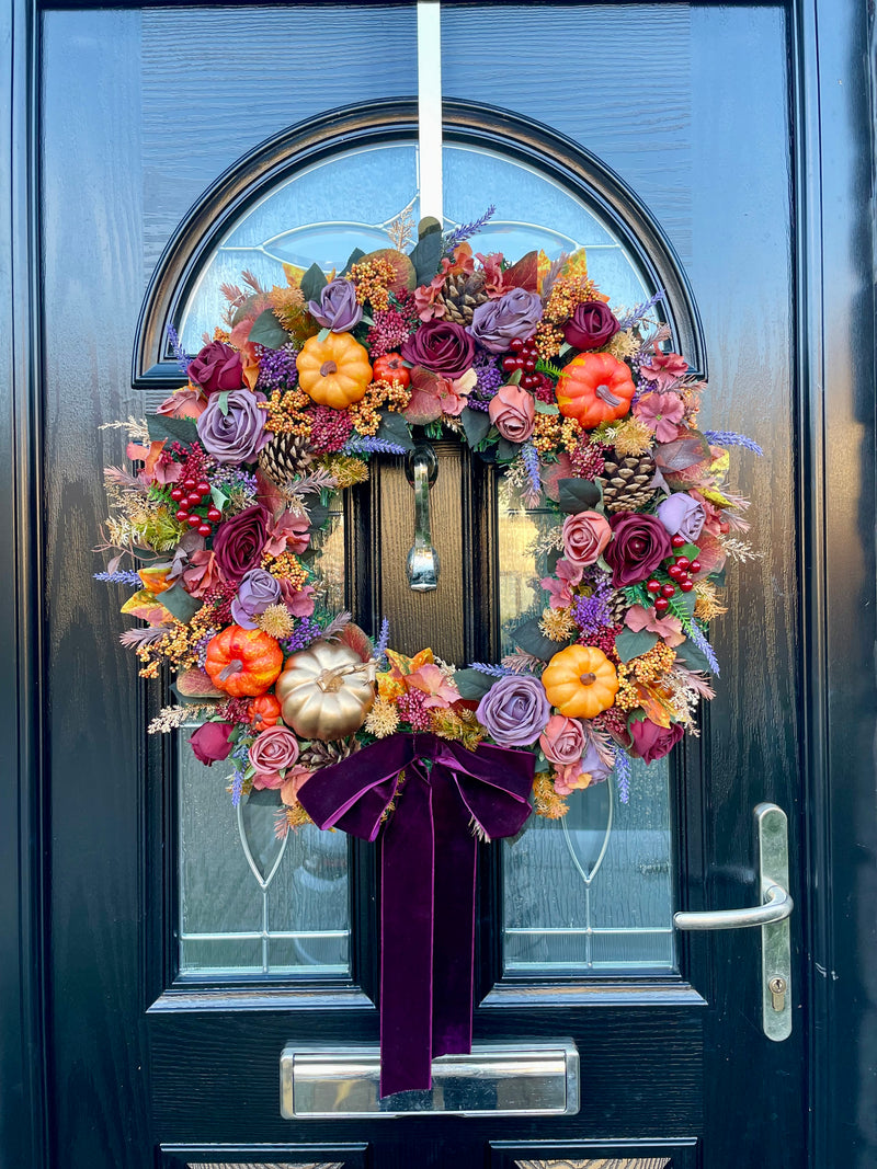 60cm autumn wreath with pinecones, pumpkins, berries and roses in shades of purple, plum and orange