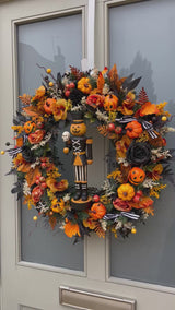 Luxury autumn wreath with Halloween pumpkin nutcracker