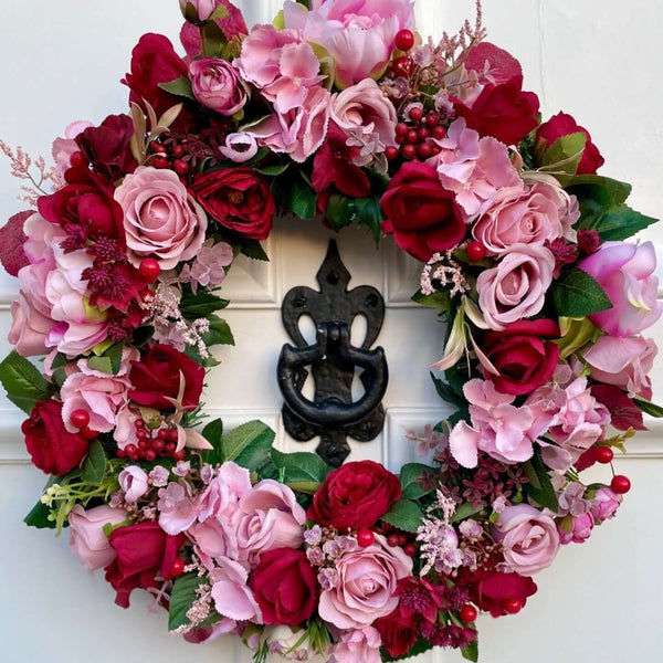 pink and red rose and hydrangea artificial wreath